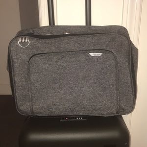 Carry on bag with trolley sleeve